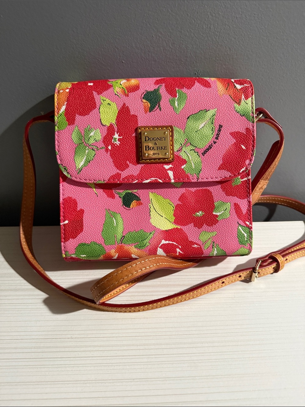 Dooney & Bourke pink and red floral crossbody bag